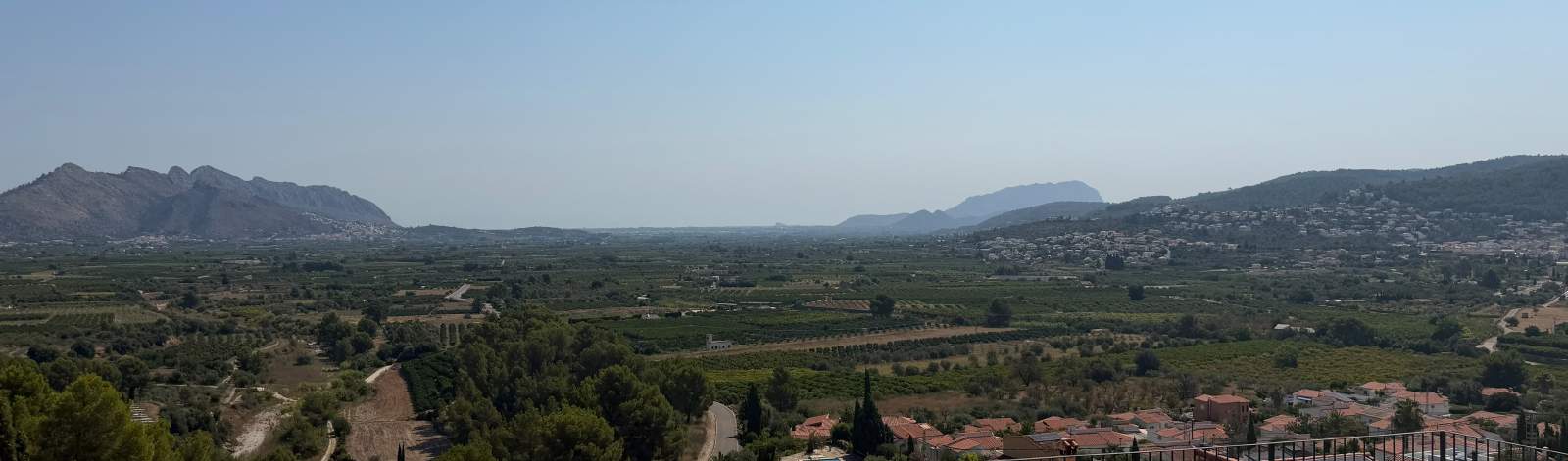 Wide view across the valley with mountains on the horizon